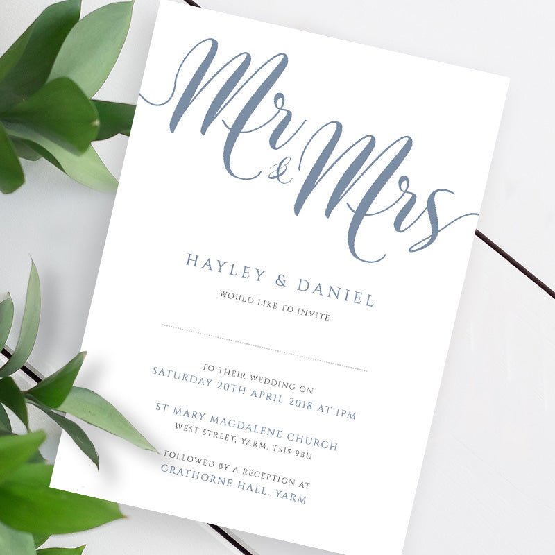 misty blue wedding invitation template on a white table