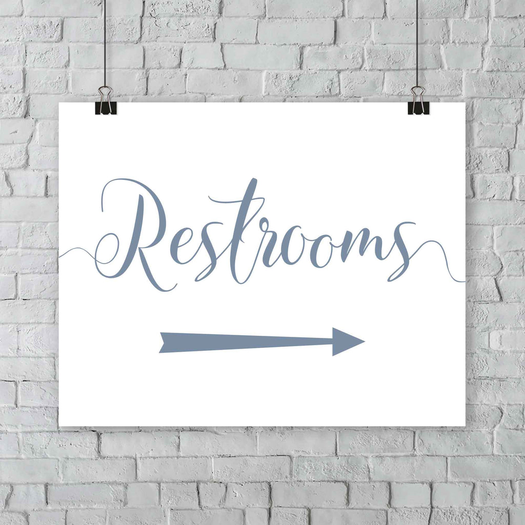 misty blue wedding restrooms arrow signage hanging from a wall