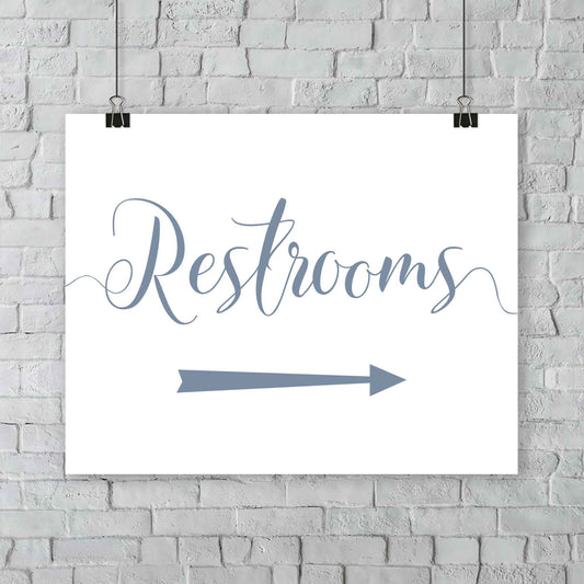 misty blue wedding restrooms arrow signage hanging from a wall
