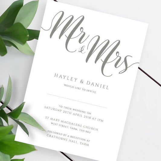 misty green wedding invitation template on a white table
