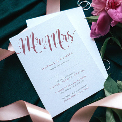 mr and mrs flamingo pink wedding invitations with flowers and ribbons