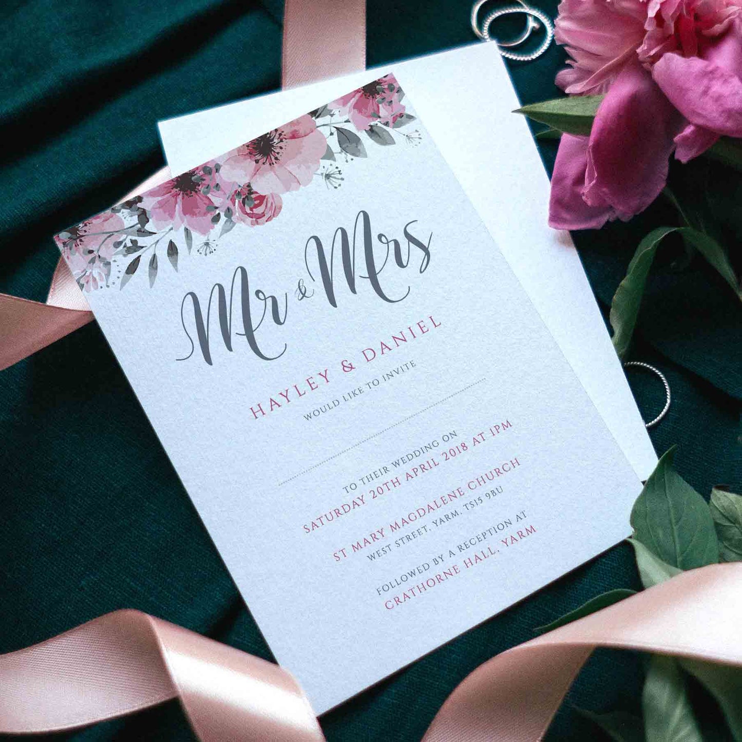 mr and mrs floral wedding invitation with flowers, ribbons and wedding rings