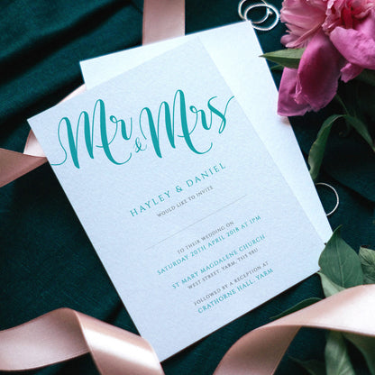 mr and mrs turquoise wedding invitations with flowers and ribbons