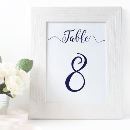 navy table number in a white picture frame