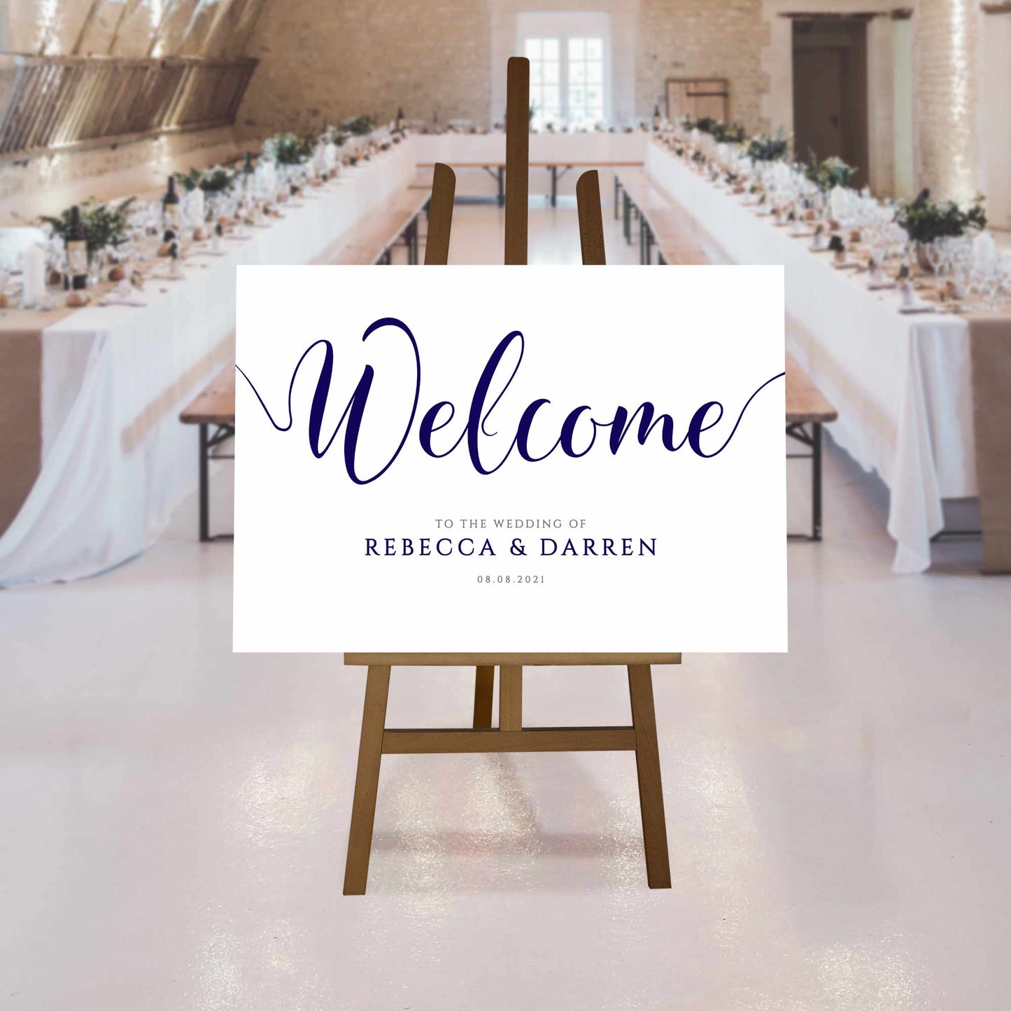 navy wedding welcome sign at a rustic wedding reception