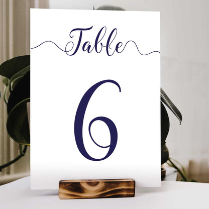 navy wedding table number in a wooden stand