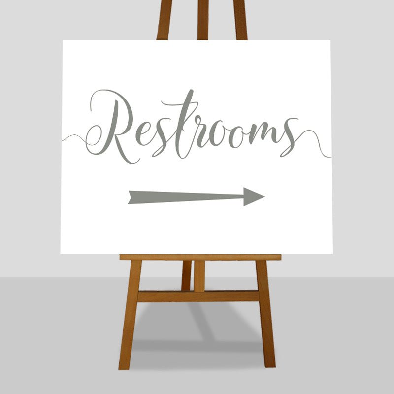olive green wedding restrooms arrow sign on an easel