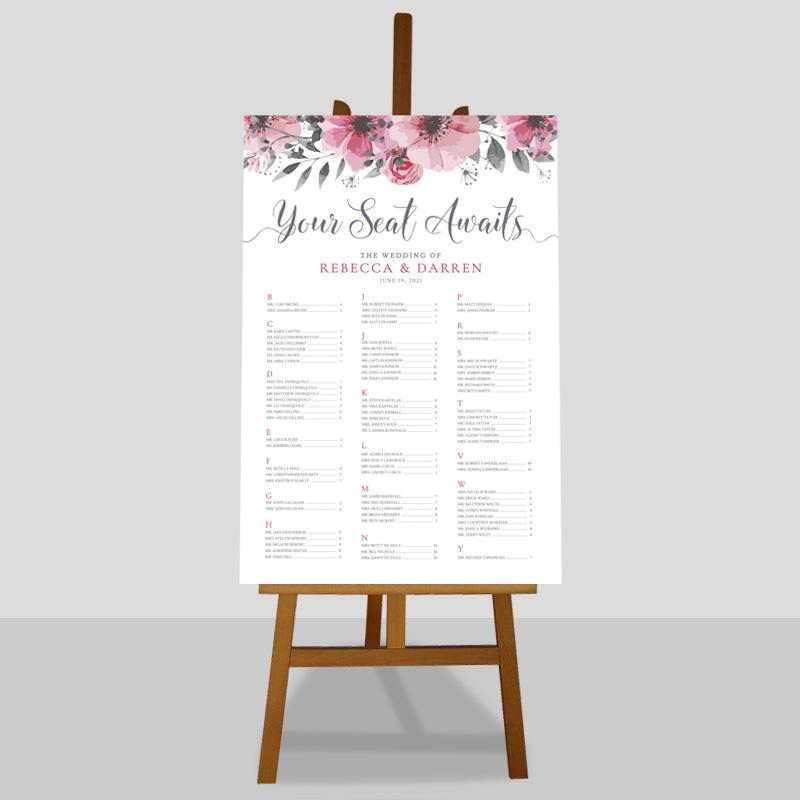 outdoor wedding floral table plan in alphabetical order on an easel