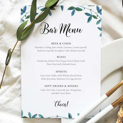 Outdoor wedding bar menu card greenery set on a wedding table
