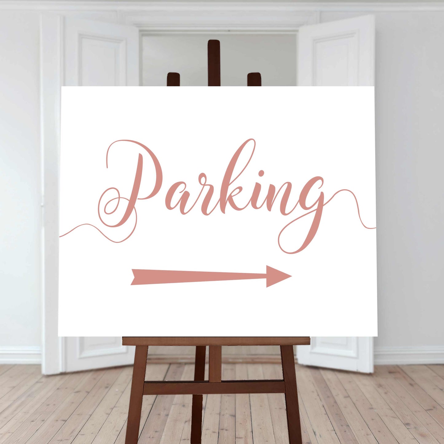 peach wedding car park directions sign with an arrow pointing right