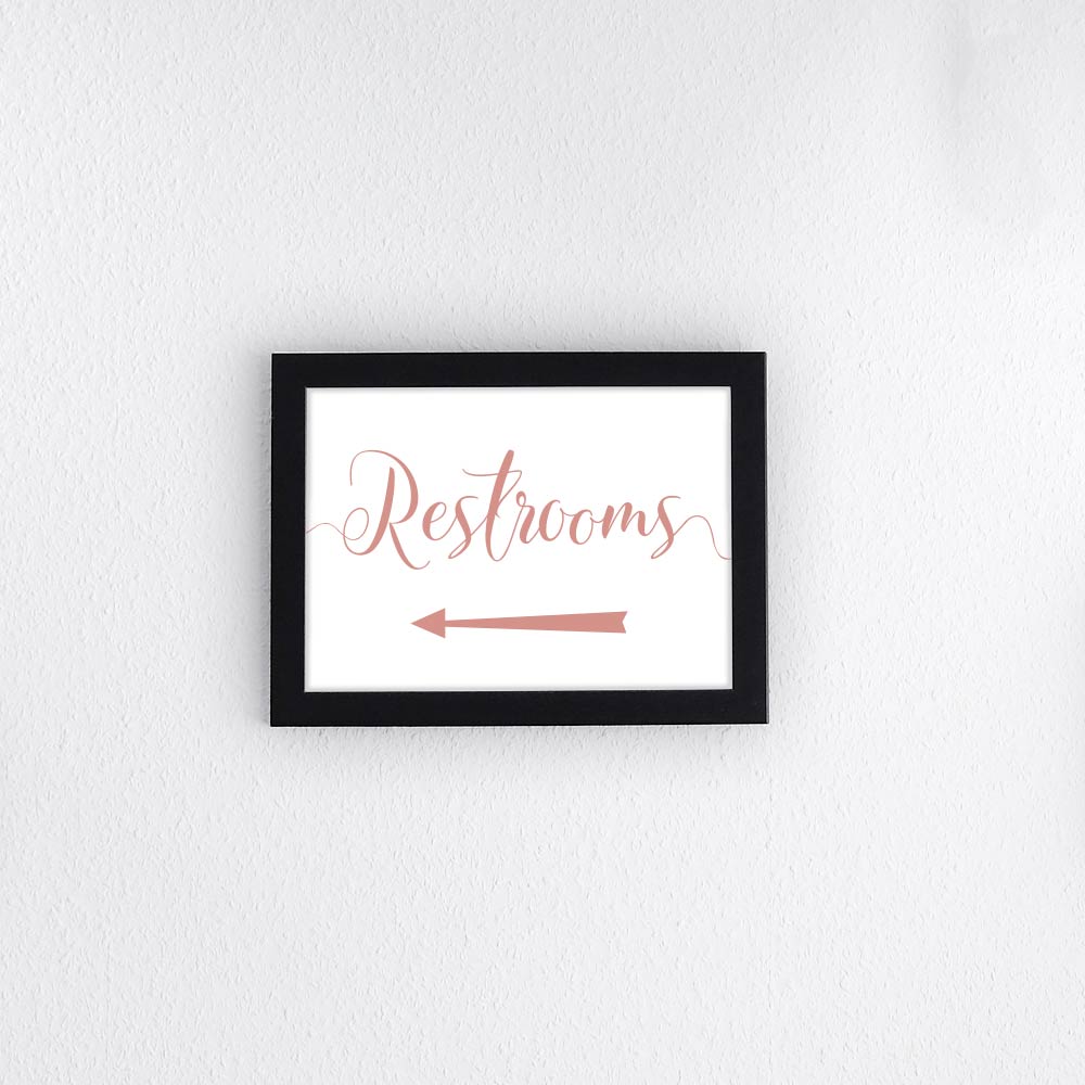 peach wedding restrooms directional arrow sign in a frame