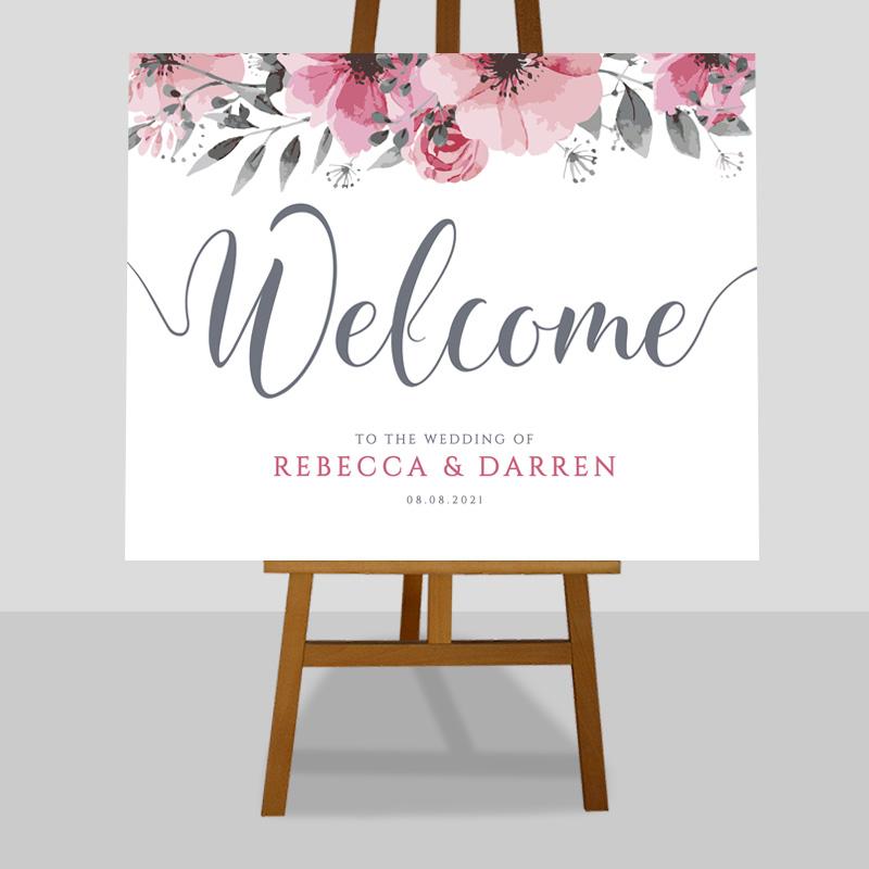 pink floral welcome sign with editable text on an easel