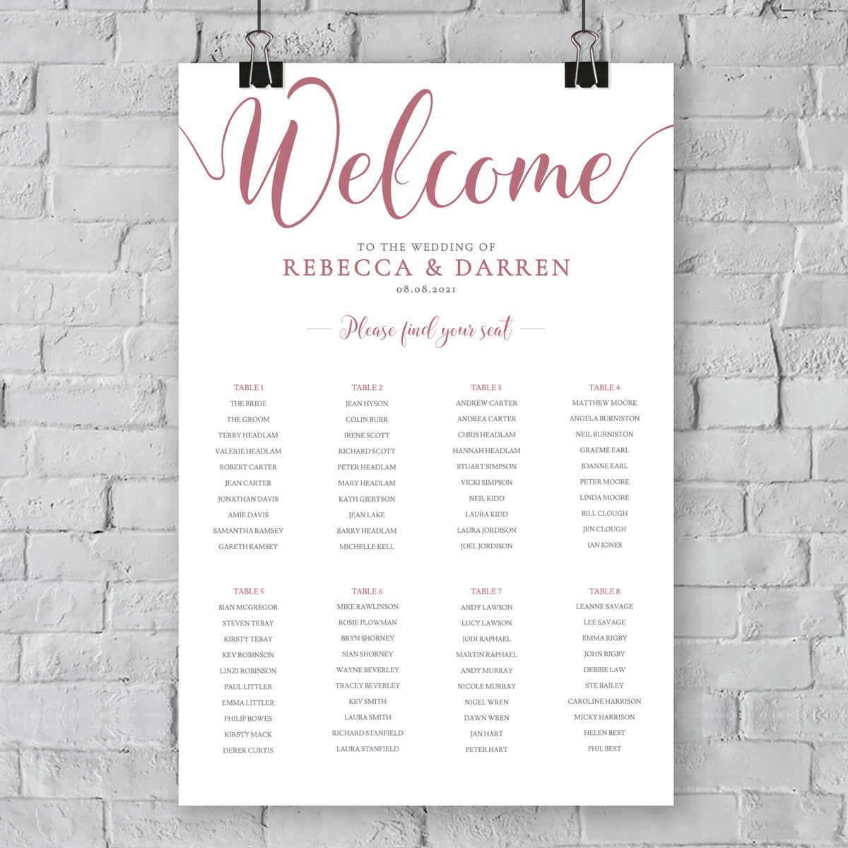 pink table plan hanging on wall