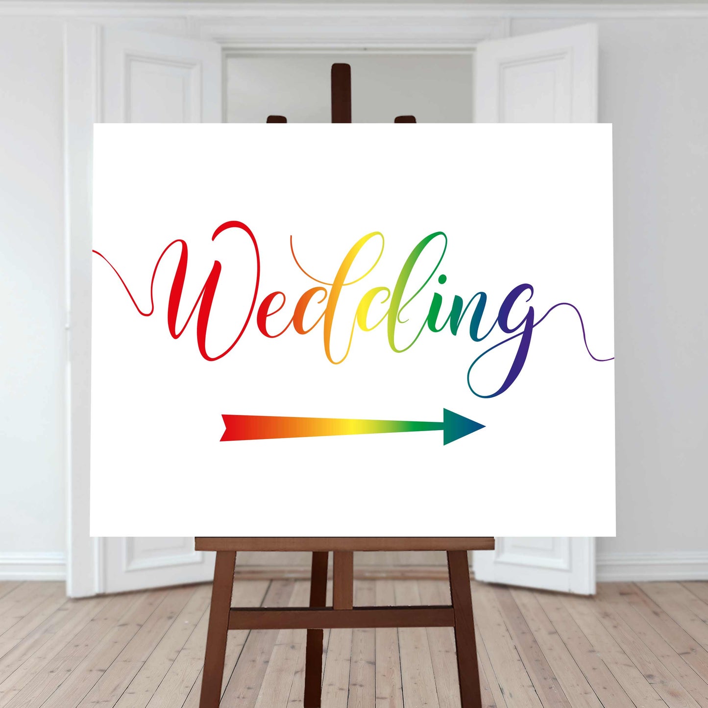 rainbow wedding directions sign with a right arrow