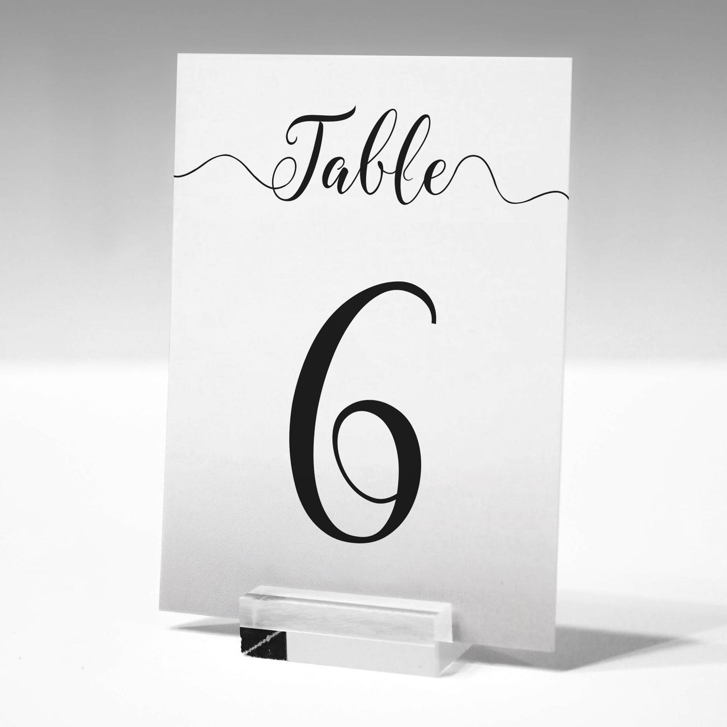 wedding table number in a glass stand