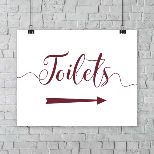 printed deep red wedding toilets arrow signage on a wall