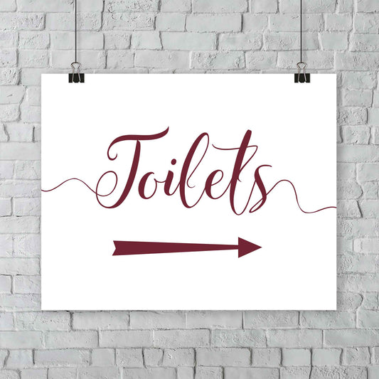 printed deep red wedding toilets arrow signage on a wall