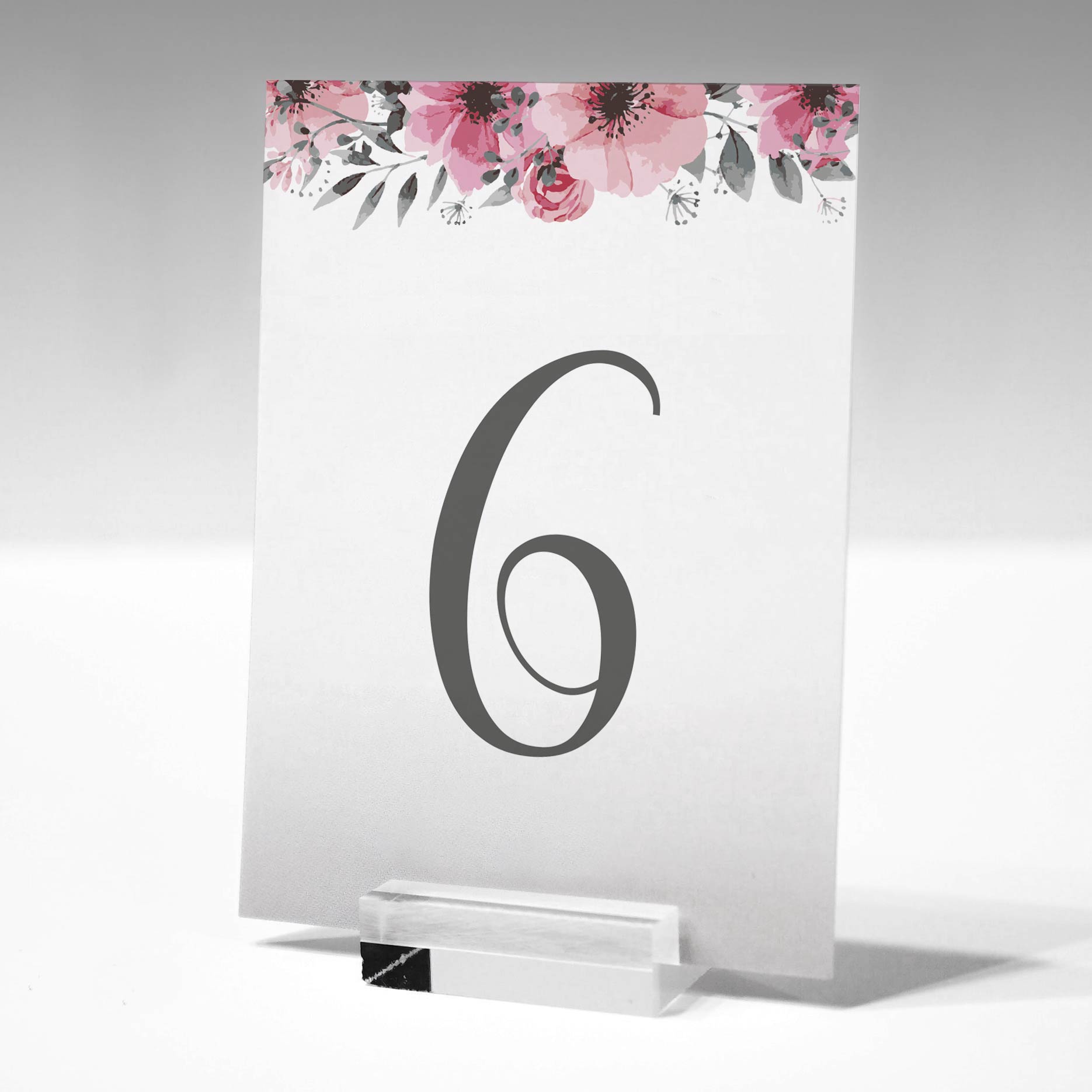 Table number 6 printed on card in a glass stand