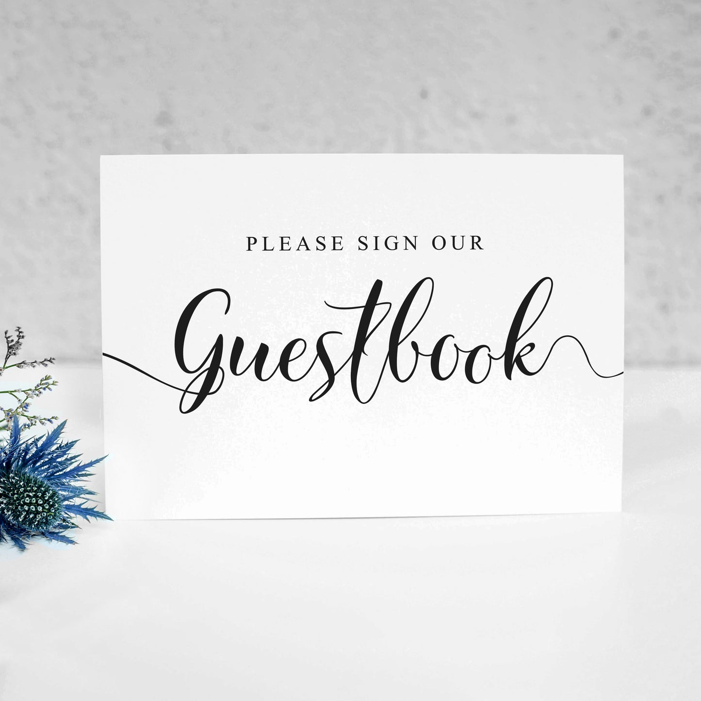 Wedding guestbook sign printed onto card standing on a table