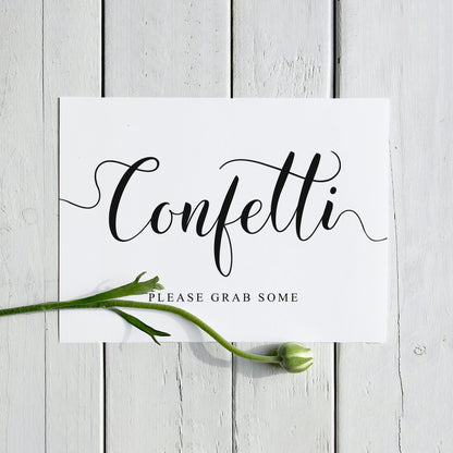 black and white wedding confetti sign printed on A4 paper