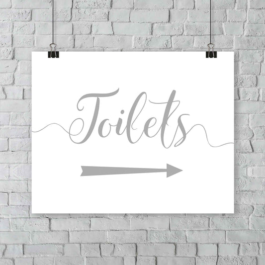 printed silver wedding toilets arrow signage on a wall