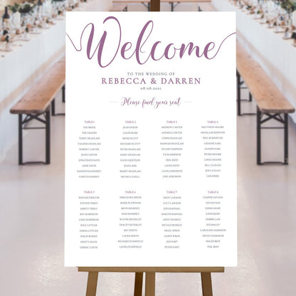 purple seating chart at rustic wedding reception