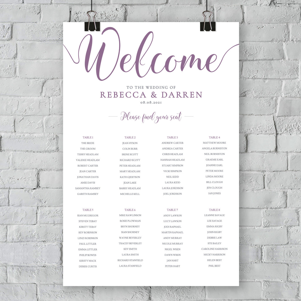 purple seating chart on wall at outdoor wedding