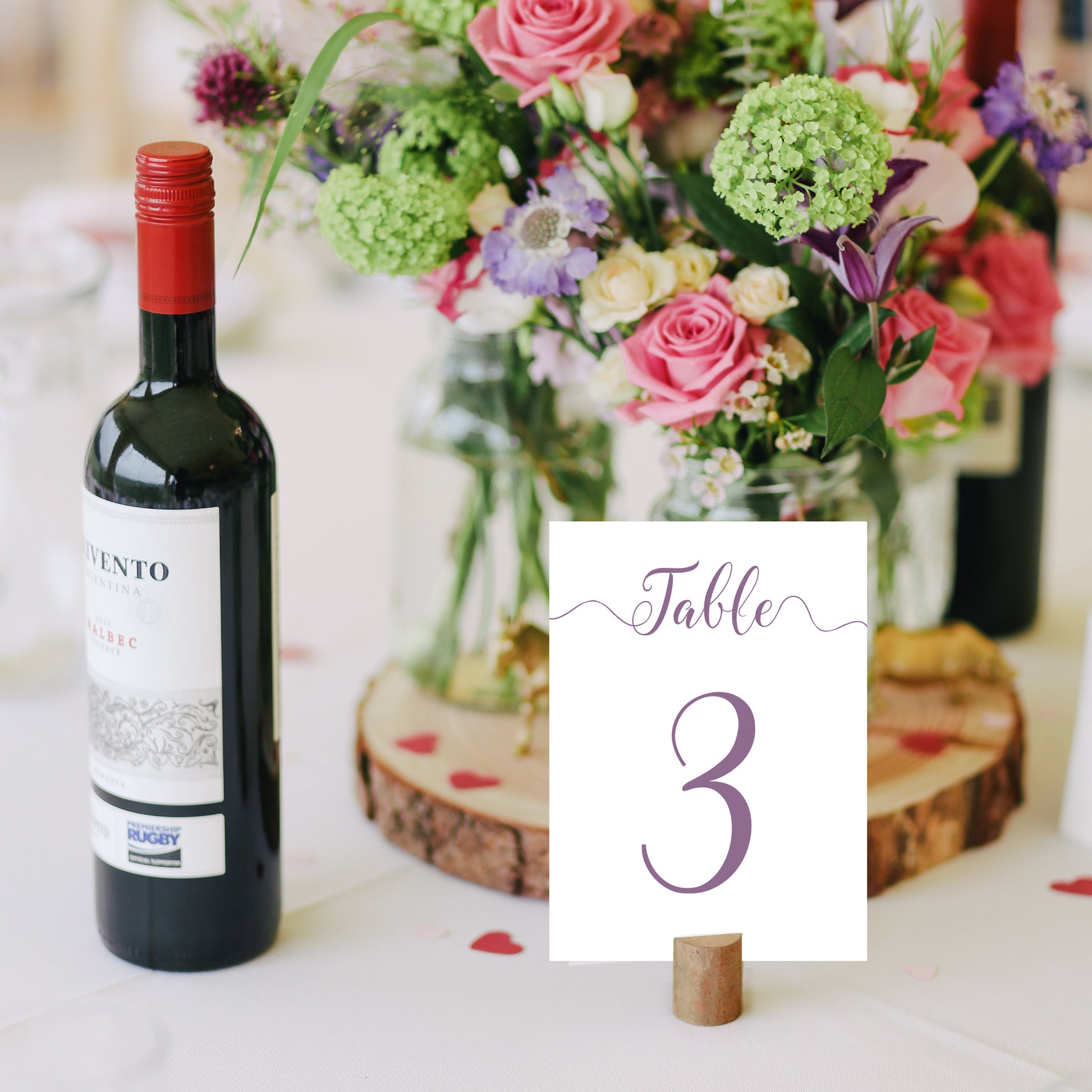 purple table number on a wedding reception table