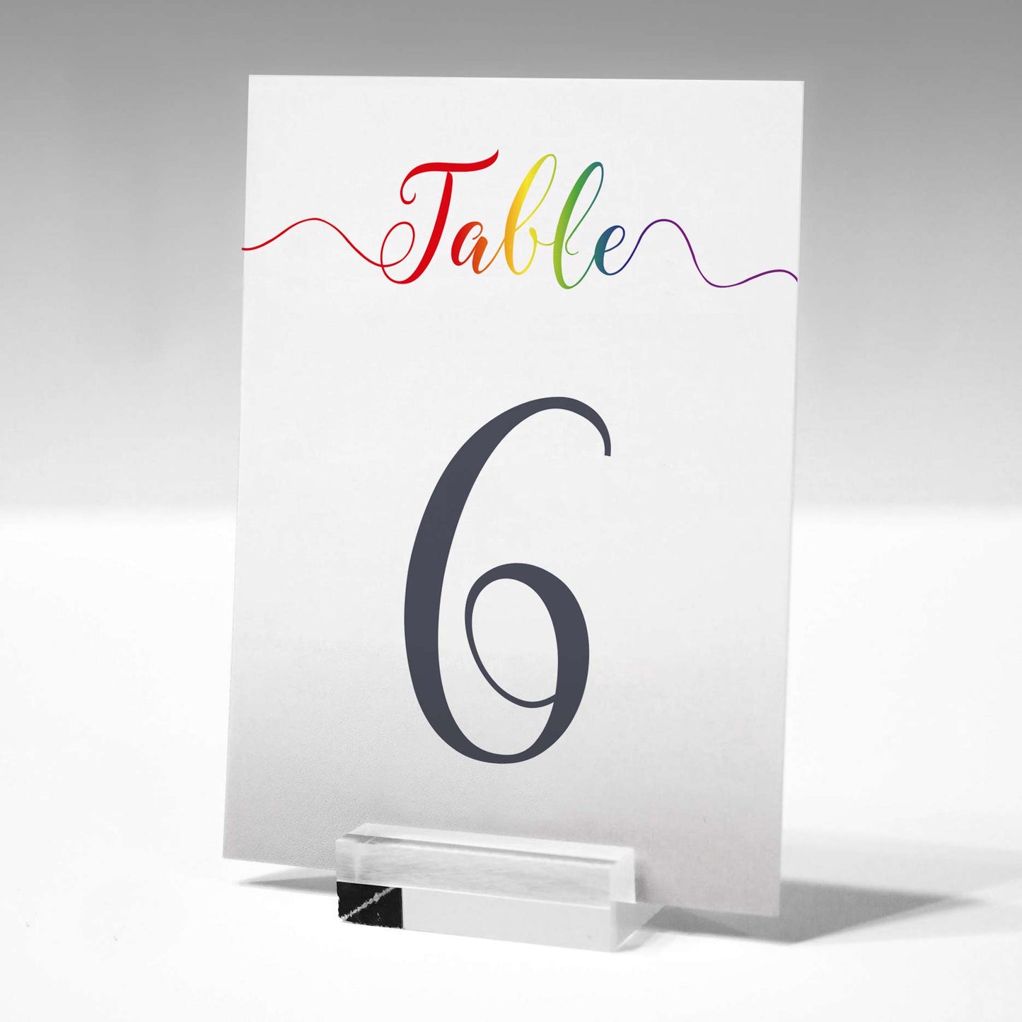 printed rainbow table number in a glass stand