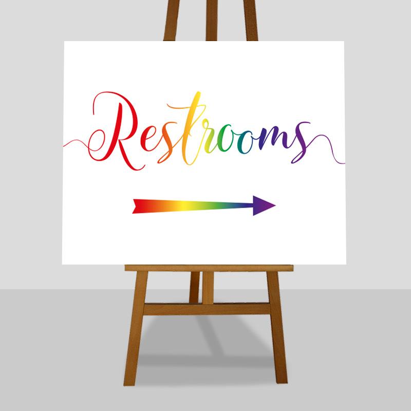 restrooms this way rainbow coloured sign