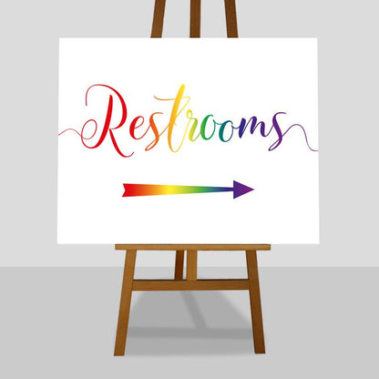 restrooms this way rainbow coloured sign