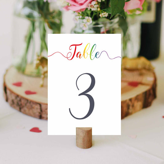 gay pride table numbers on a wedding table