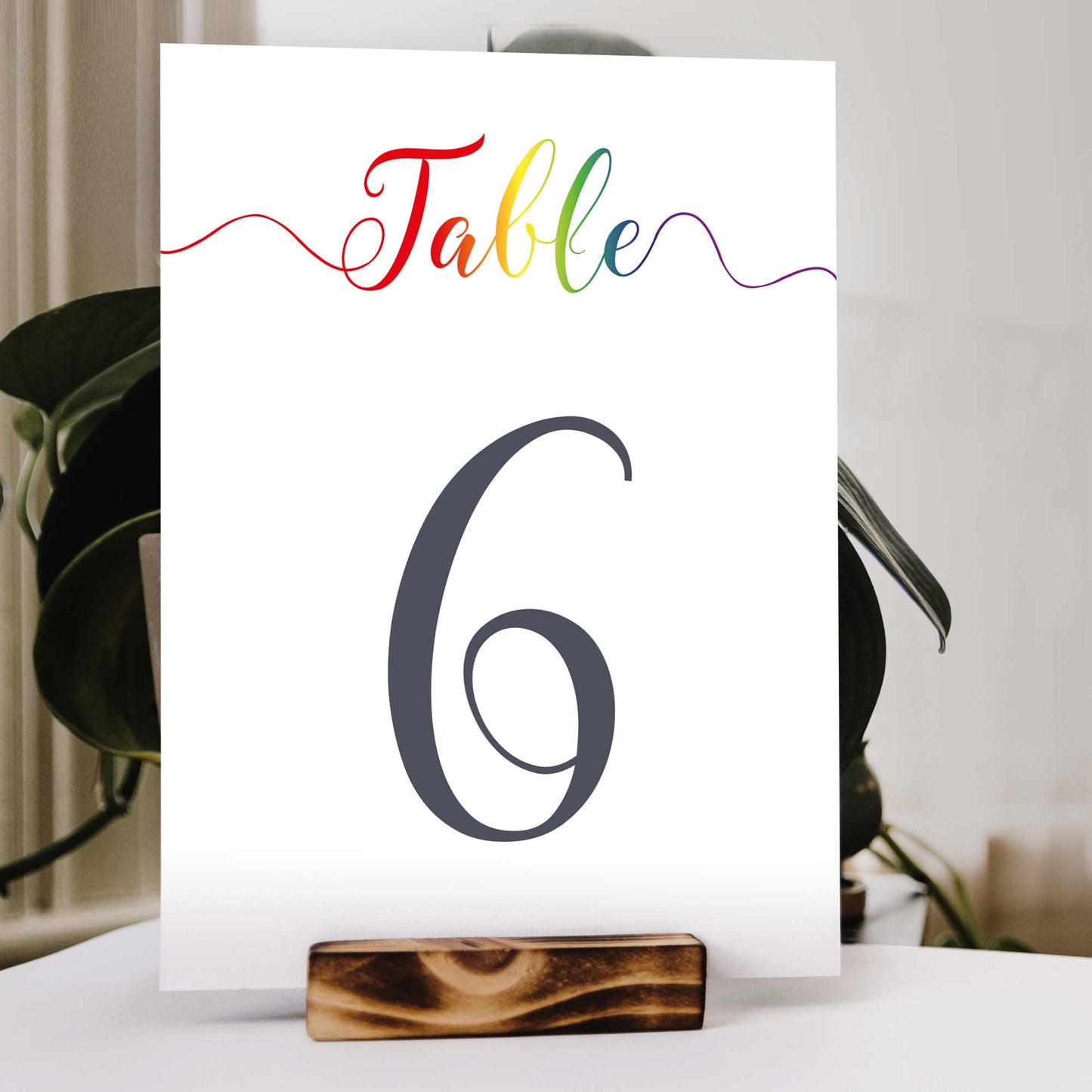 printable rainbow table numbers in a wooden stand