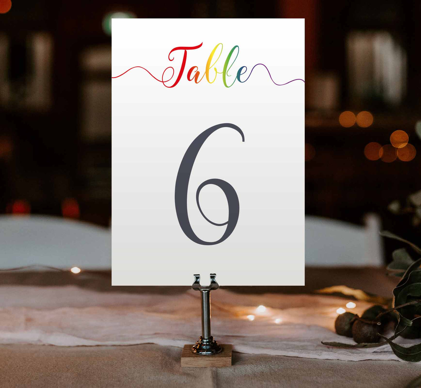 pride rainbow table number at a wedding reception