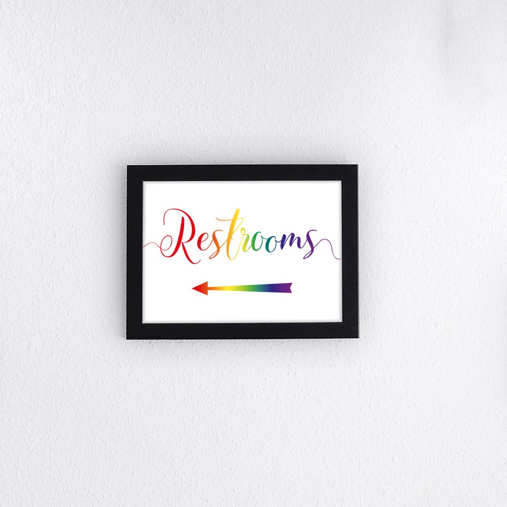 rainbow restrooms sign with left arrow framed print