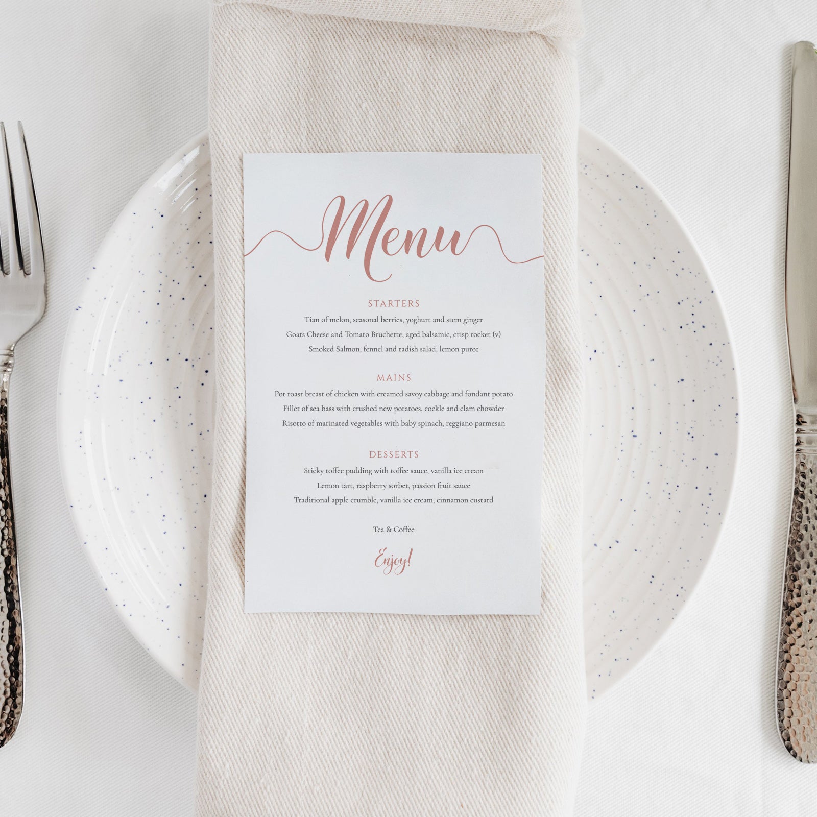 rose gold menu printed on card on a wedding table