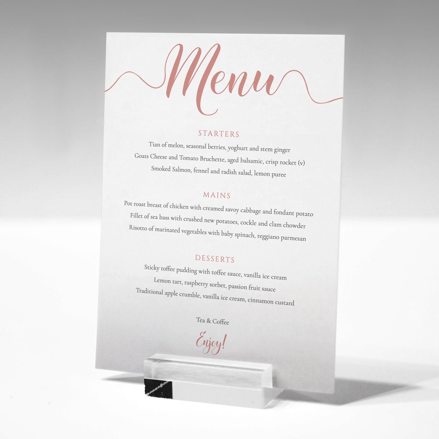 rose gold wedding menu card in a glass menu stand