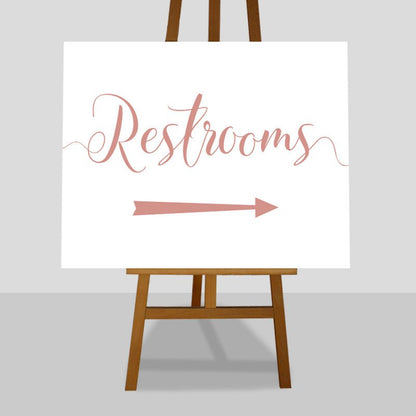 rose gold wedding restrooms arrow sign on an easel