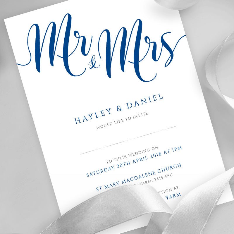 royal blue wedding invitation printed on white card with ribbons overlayed