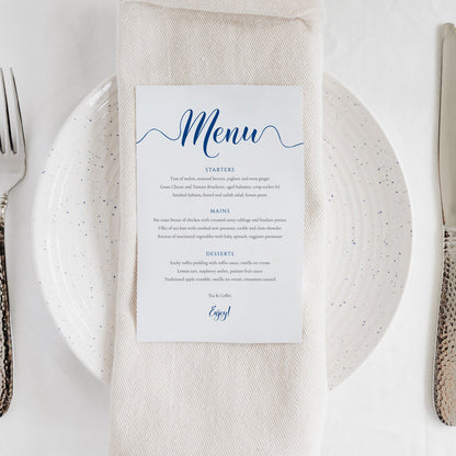 royal blue wedding menu card on a dinner plate