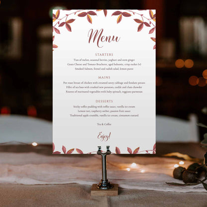 rustic autumn wedding menu card in a metal stand