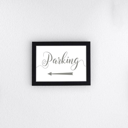 sage green directional parking sign with arrow pointing left