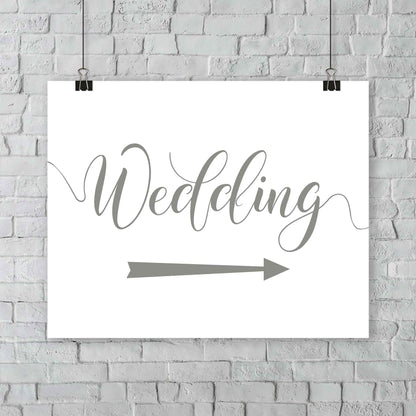 sage green wedding arrow sign print hanging from a wall