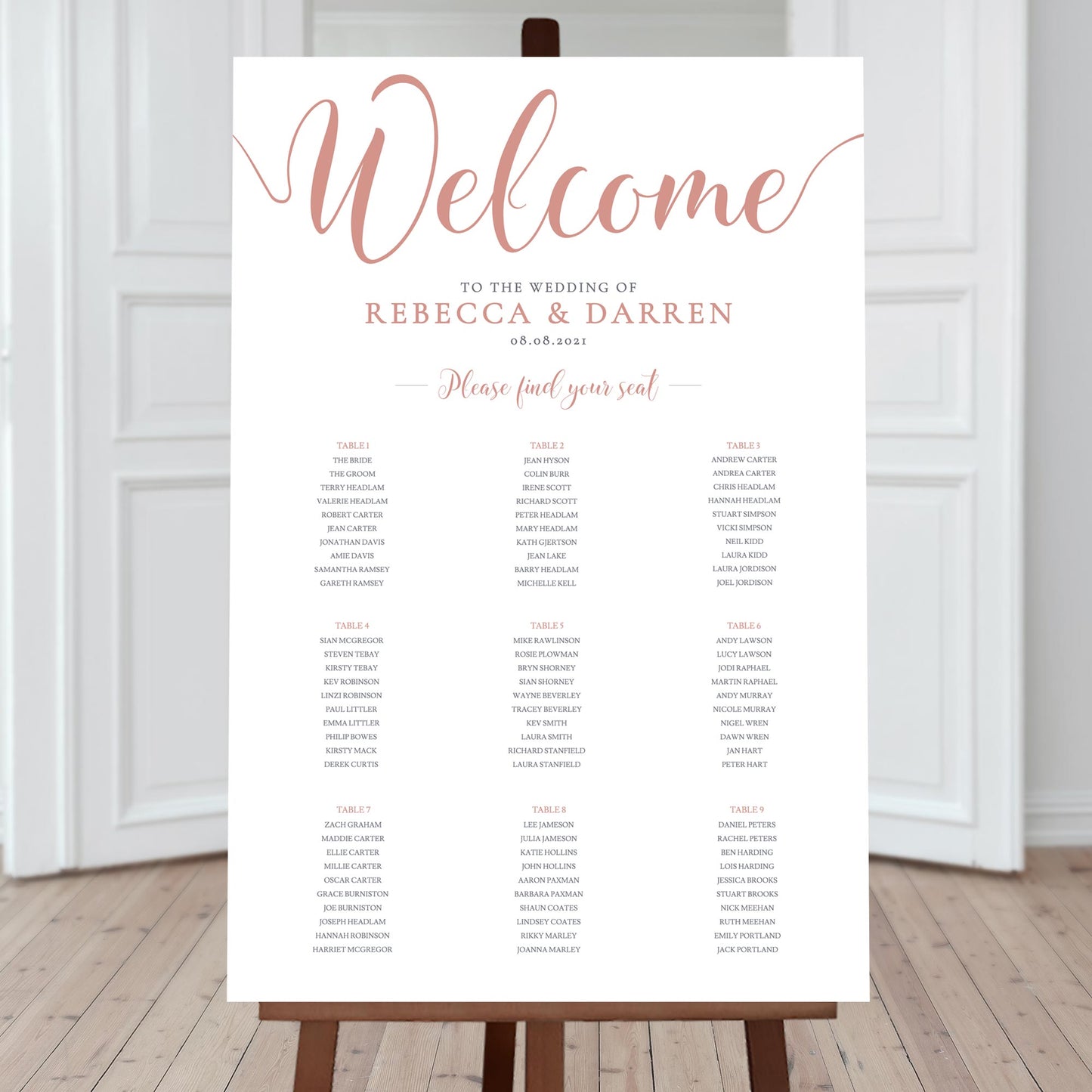 salmon pink wedding seating chart with 9 tables