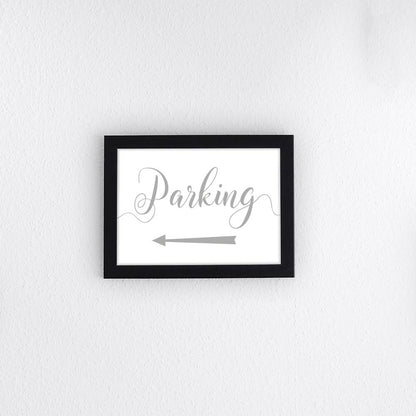 silver directional parking sign with arrow pointing left