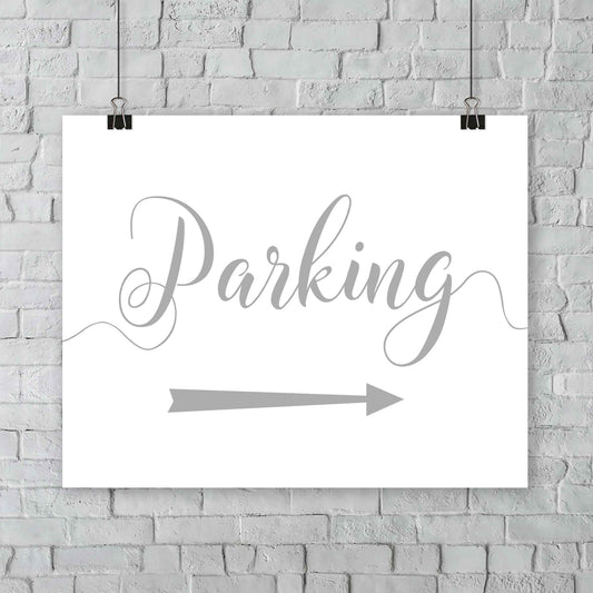 silver parking lot arrow sign hanging from a wall