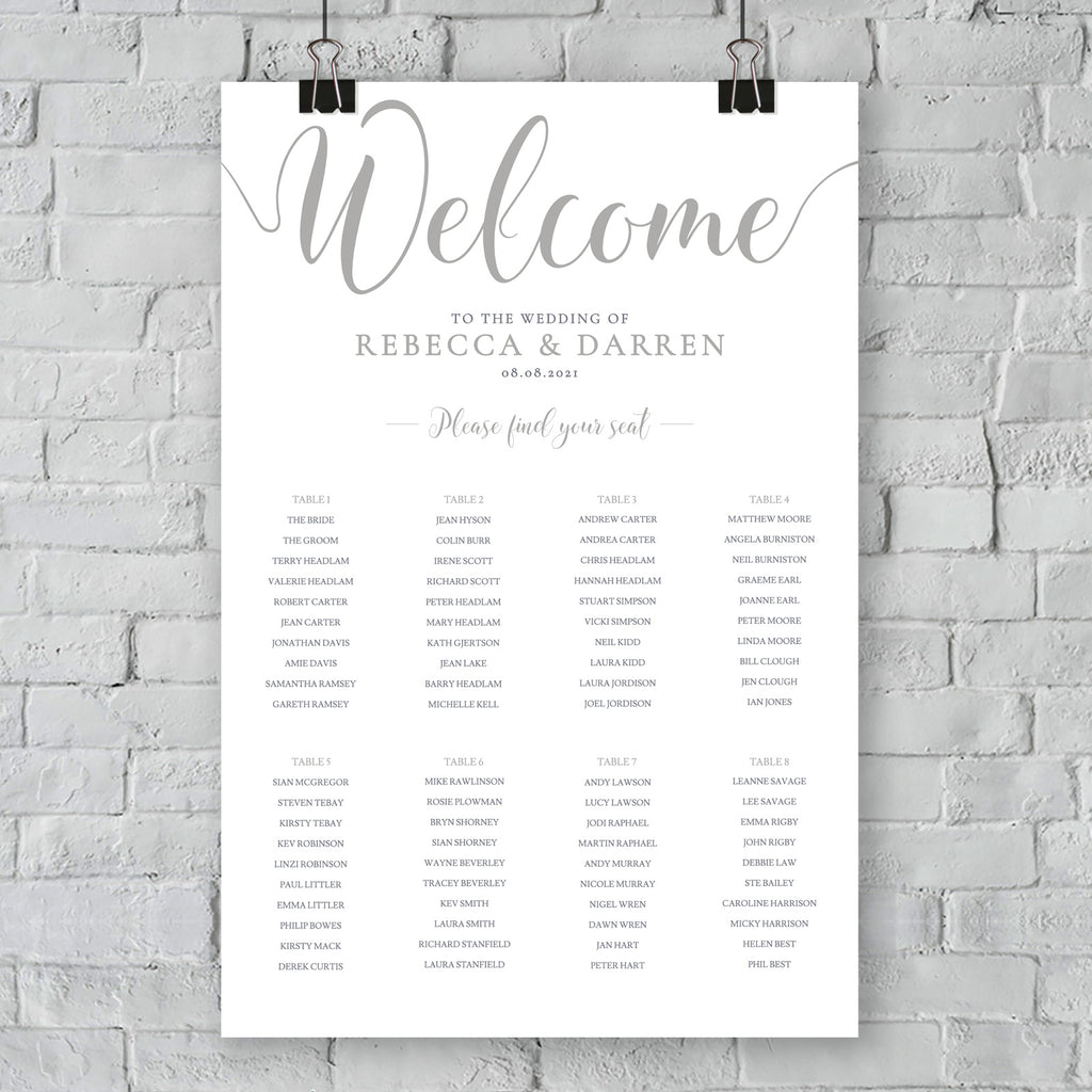silver seating chart on wall at an outdoor wedding