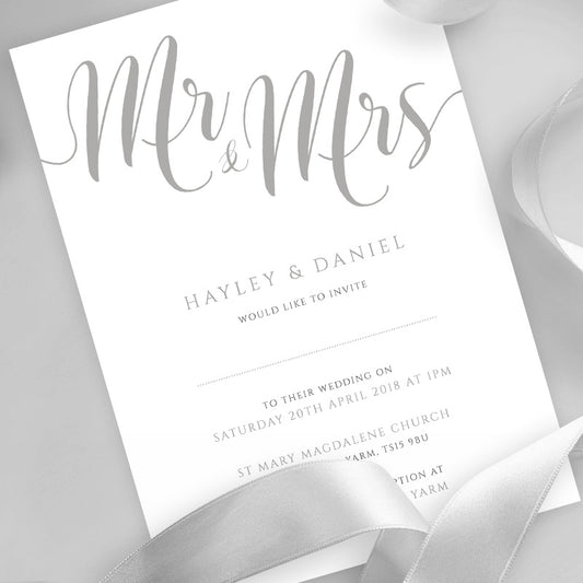silver wedding invitation printed on white card with ribbons overlayed
