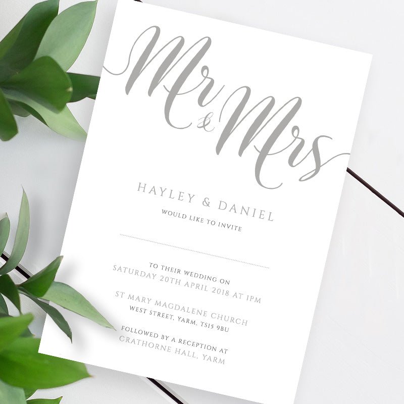 silver wedding invitation template on a white table