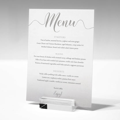 silver wedding menu card in a glass menu stand